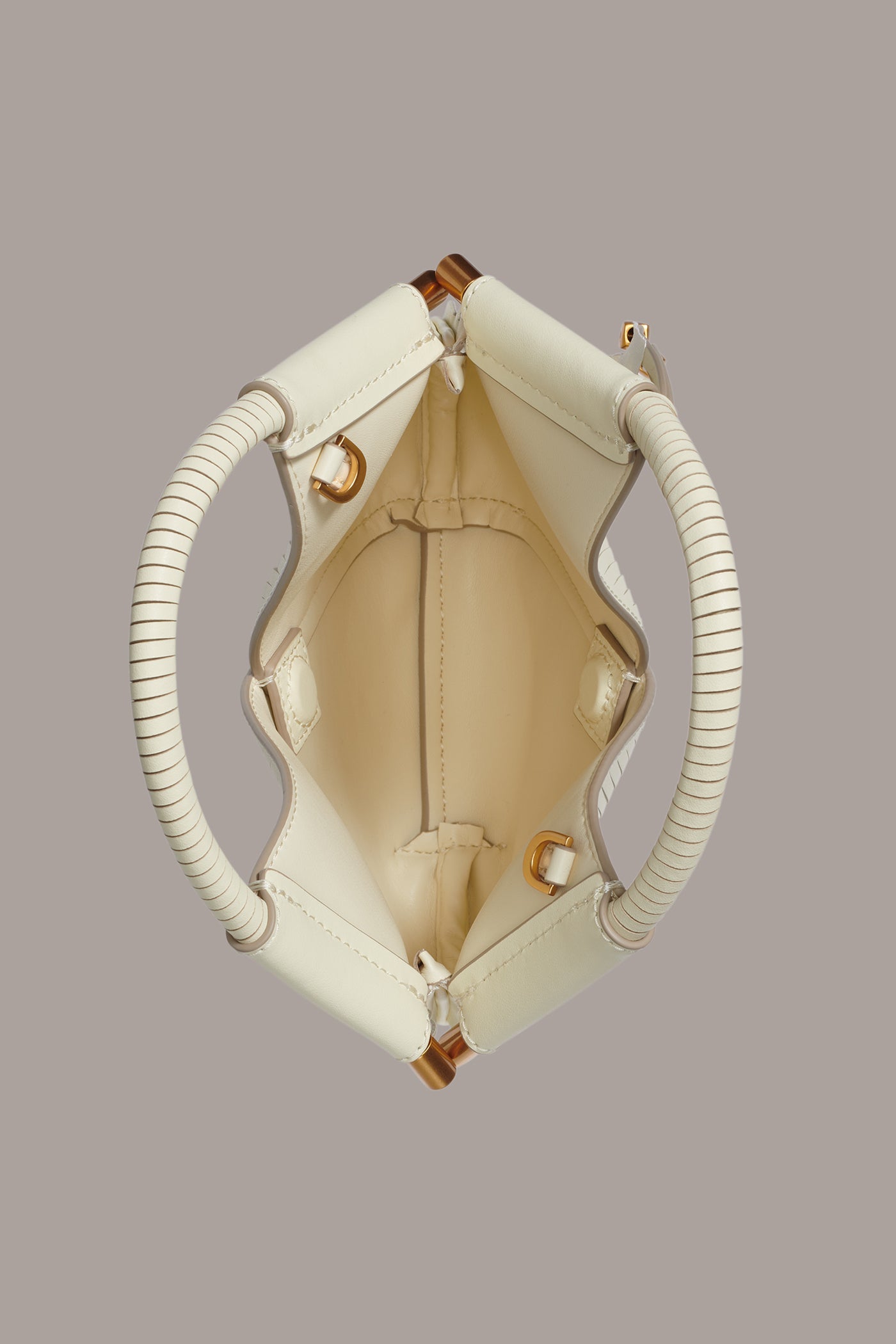 Butter Cream BALDWIN LASER-CUT LEATHER MICRO CROSSBODY BAG Donna Karan